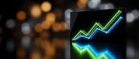 Digital tablet displaying glowing neon growth chart with upward trending arrows against blurred bokeh background for business analytics and financial success.