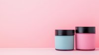 Minimalist cosmetic jars in pastel blue and pink with black lids on pink background, mockup for beauty and skincare products presentation.
