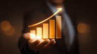 Businessman holding glowing golden growth chart with upward arrow, symbolizing financial success, investment performance, and business development.
