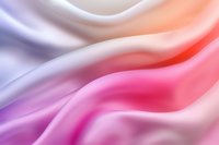 Smooth flowing abstract background with gentle waves in pink, purple and coral gradient colors creating soft luxurious satin texture effect.