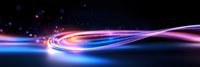 Glowing neon light trails with vibrant pink and blue colors against dark background create dynamic motion effect for technology and data flow concepts.