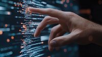 Male hand touching digital code on virtual screen with programming language syntax and bokeh light effects in dark environment.