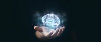 Businessman holding glowing digital brain hologram in cupped hands representing artificial intelligence, machine learning and innovative technology solutions.