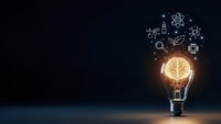 Glowing light bulb with brain filament surrounded by science icons on dark background representing innovation, creativity and scientific research concepts.