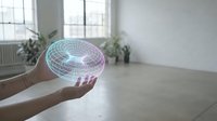 Hands holding holographic brain projection in modern minimalist room with natural light. Futuristic neuroscience technology concept for medical research.