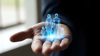 Businessman holding holographic family figures in palm representing life insurance protection and financial security planning for loved ones.