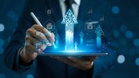 Businessman using digital tablet with holographic growth arrows and data analytics icons for business strategy and financial planning presentations.