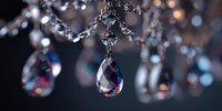 Elegant crystal chandelier with sparkling glass droplets and chain details creating luxurious lighting ambiance for interior design and home decor.
