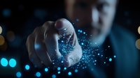 Magical blue glowing particles floating from hand against dark background with bokeh lights, creating mystical atmosphere for fantasy and spiritual concepts.