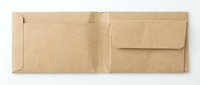 Kraft paper envelope with open flap and closed pocket compartment, isolated on white background, ready for packaging design, stationery mockups, and shipping templates.