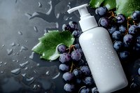 White cosmetic bottle with pump dispenser surrounded by fresh blueberries and green leaves on dark wet surface for skincare and beauty products.