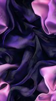 Luxurious flowing silk fabric in deep purple and pink creates elegant waves and folds, abstract background texture for fashion and luxury designs.