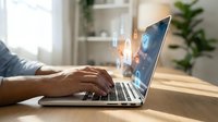 Professional businessman hands typing on laptop with glowing digital network icons and connectivity symbols floating above keyboard in modern office workspace.