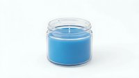 Blue scented candle in clear glass jar with cotton wick isolated on white background for home decor and aromatherapy relaxation products.