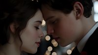 Romantic close up of young caucasian couple about to kiss with soft bokeh lights in background creating intimate atmosphere. Gentle facial expressions show tender moment.