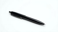 Black ballpoint pen isolated on white background for office supplies and writing instruments design projects.