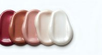 Cosmetic foundation makeup swatches in various skin tones from dark to light on white background for beauty and skincare product testing.