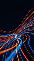 Dynamic light trails in blue and orange creating flowing energy waves on dark background for modern digital design projects.
