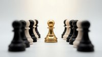 Golden pawn stands out among blurred black chess pieces on white background. Leadership, strategy, business success and standing out concept.