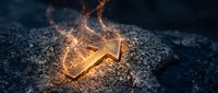 Glowing golden arrow symbol with magical fire sparks and energy particles on dark textured stone surface for business growth and direction concepts.