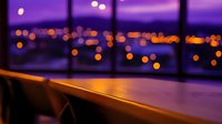 Blurred city lights through panoramic window at dusk, wooden table in foreground creates cozy atmosphere for evening dining or relaxation space.