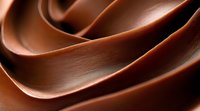 Smooth waves of dark chocolate create elegant swirls and curves in macro photography, showcasing rich texture and glossy surface for confectionery and dessert designs.
