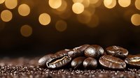 Roasted coffee beans on dark background with golden bokeh lights creating magical atmosphere, macro shot highlighting rich texture and aroma.