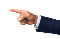 Male hand in business suit sleeve pointing finger to side on white background, isolated gesture for professional presentations and business concepts.
