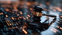 Wooden judge gavel on circuit board with glowing orange lights, representing digital law, cyber security and technology regulations in modern justice system.