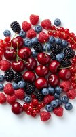 Fresh mixed berries collection with blueberries, raspberries, blackberries, cherries and red currants on white background for healthy eating and cooking.