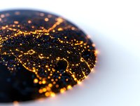 Aerial night view of glowing city lights forming interconnected network patterns, captured from above with selective focus creating abstract circular composition.