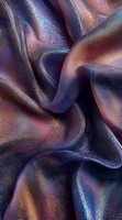 Shimmering fabric with metallic glitter effect in deep purple and copper tones creates luxurious flowing waves and folds for fashion and textile backgrounds.