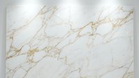 White marble surface with elegant gold veining patterns creating luxurious natural stone texture for interior design and architectural applications.