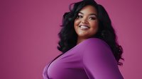 Young plus size Asian woman with long black wavy hair wearing purple dress smiling confidently against magenta background, body positive portrait in studio lighting.