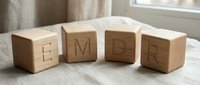 Wooden alphabet blocks spelling EMDR on table near window, therapy concept for mental health treatment and psychological healing sessions.