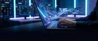 Businessman using holographic tablet with digital interface and data visualization in modern tech environment for business analytics and innovation.