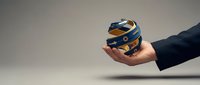 Hand holding blue and gold globe with business professional sleeve, representing global commerce, international trade, worldwide connectivity, and corporate expansion opportunities.