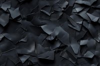 Dark geometric abstract background with overlapping torn paper pieces creating dynamic shadows and depth, suitable for modern design projects and presentations.