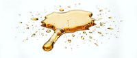 Isolated golden mirror with handle and splashing liquid droplets on white background, suitable for beauty, cosmetics, and wellness design projects.