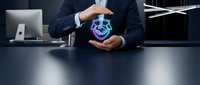 Businessman in dark suit holding glowing digital globe, representing global business, technology innovation, and international commerce at modern office desk.