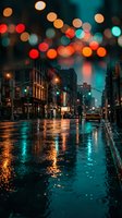 Rainy city street at night with colorful bokeh lights reflecting on wet pavement creating atmospheric urban scene for moody backgrounds and editorial use.