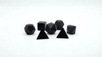 Black geometric shapes collection including cubes, spheres, pyramids and polyhedrons arranged on white background for modern design projects.