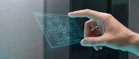 Caucasian male hand holding transparent digital tablet displaying circuit board schematic, futuristic technology interface for software development and engineering applications.