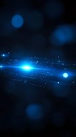 Glowing blue light streak with sparkles and bokeh effects on dark background creates futuristic atmosphere for technology and space concepts.