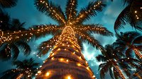 Tropical palm tree decorated with golden string lights against twilight sky creating magical holiday atmosphere for vacation resort celebration.