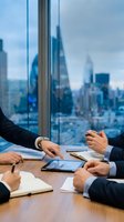 Business professionals collaborating with digital tablet in modern office conference room overlooking city skyline for corporate meetings and teamwork.