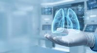 Medical professional holding glowing lung hologram in modern healthcare facility for respiratory treatment and pulmonary diagnosis consultation.