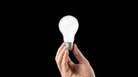 Hand holding a glowing light bulb isolated on transparent background, ready for t-shirt design, stickers, clipart, print on demand, and sublimation projects.
