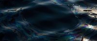 Swirling dark vortex with iridescent blue and gold light effects, creating an abstract cosmic or digital tunnel effect suitable for sci-fi backgrounds and visual effects projects.