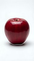 Fresh red apple isolated on white background, perfect for food, nutrition, health and wellness design projects.
